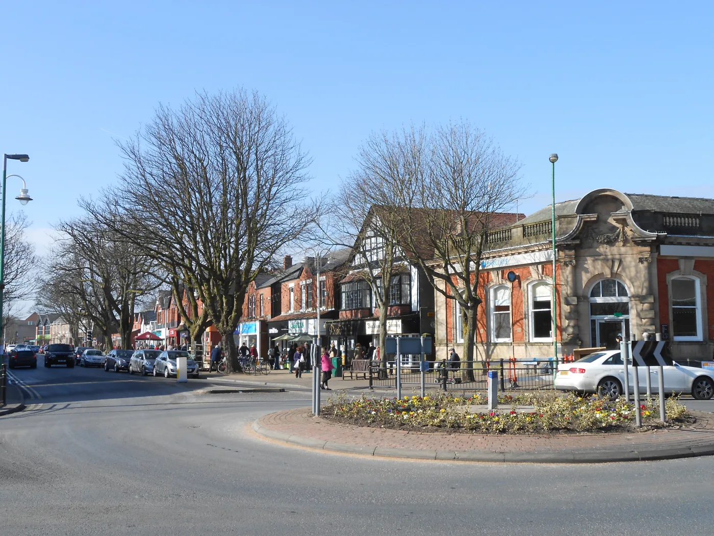 Formby village centre, photographed in 2013. The sports bar is on the first floor of Troutbeck House, 27 Brows Lane, which is not shown here.